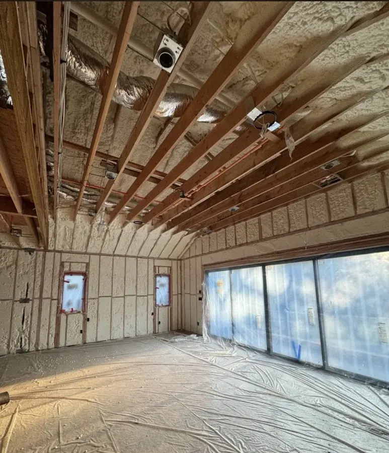 Interior walls and ceiling insulated with spray foam during new construction in Oceanside